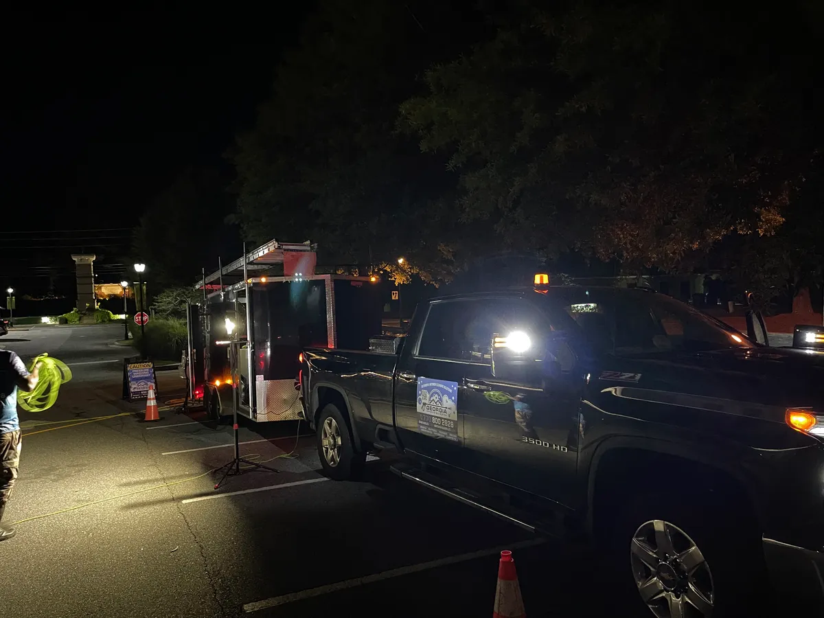 Georgia Bubbles rig set up in the Suwanee Jubilee parking lot after close, with cones and work lights
