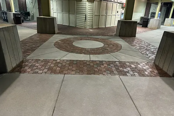 Brick paver plaza and concrete walk at a shopping center in Milton, GA, after washing