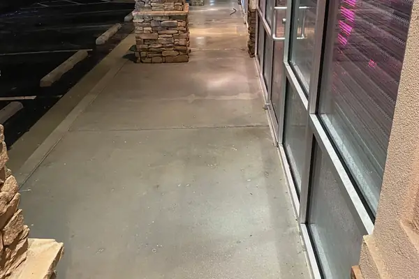 Storefront walkway after a Georgia Bubbles night pressure wash
